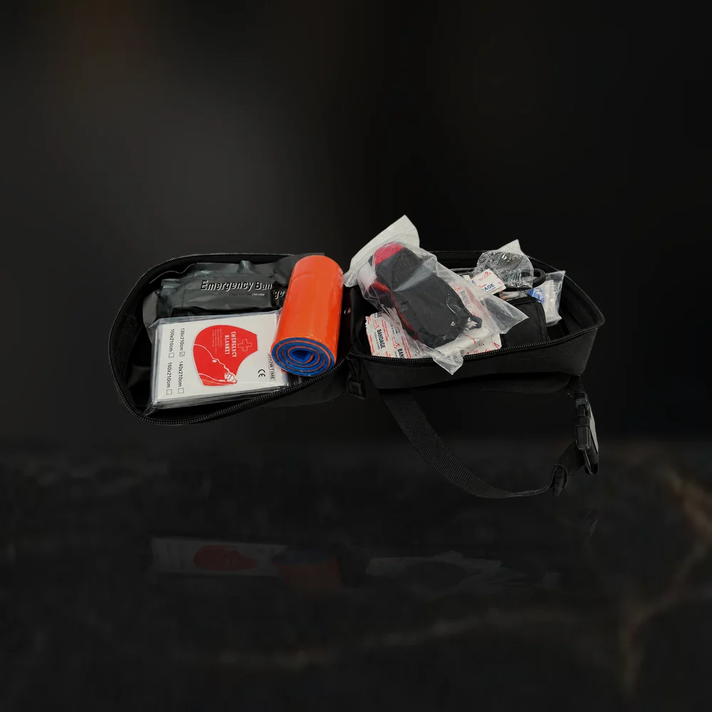 The emergency kit carry case opened, showing the items stowed inside